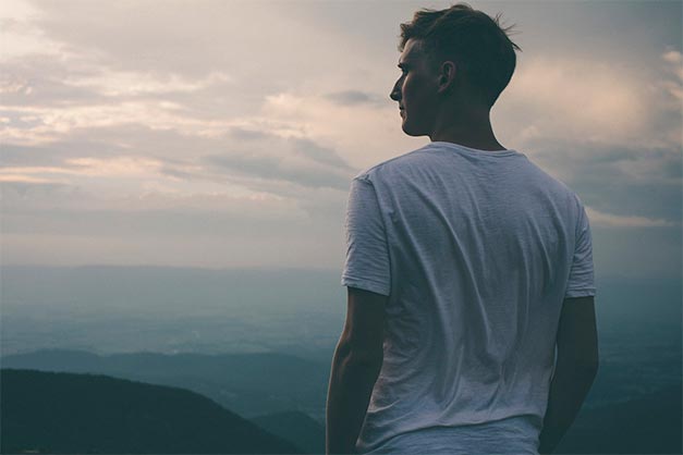 guy looking out into the mountains composition tip using space