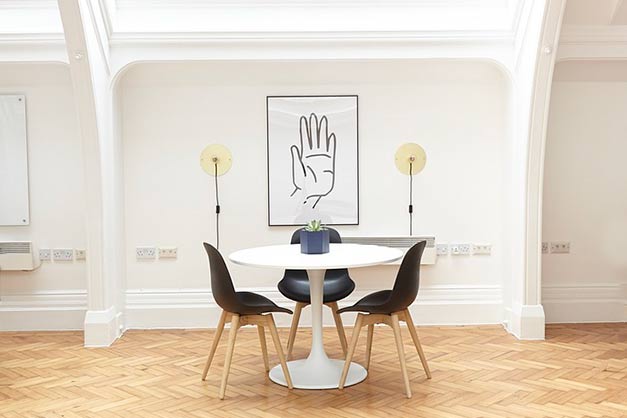 large tall framed print displayed in small space
