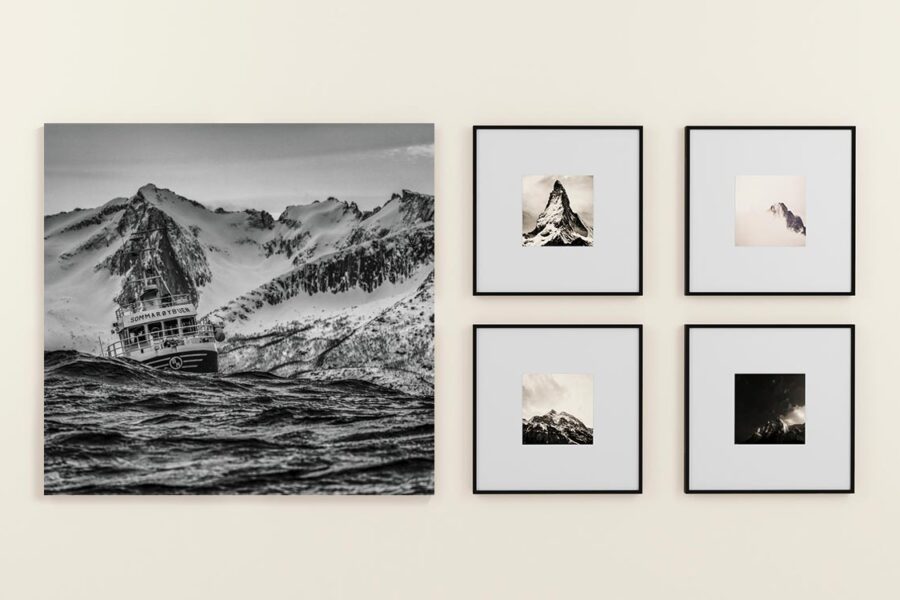 Canvas print beside framed fine art paper prints on a wall comparing the two print materials