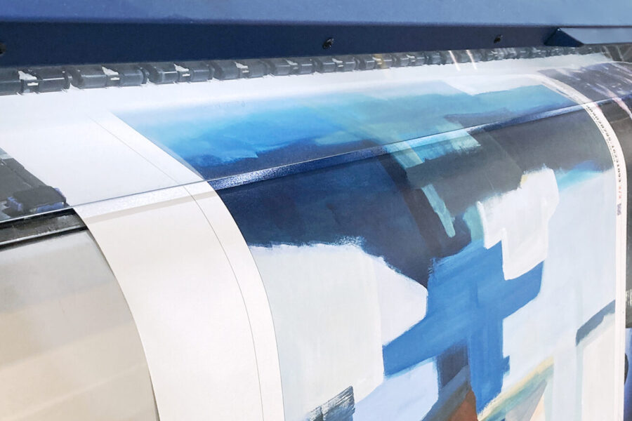 Large format printer producing an abstract art reproduction on canvas material