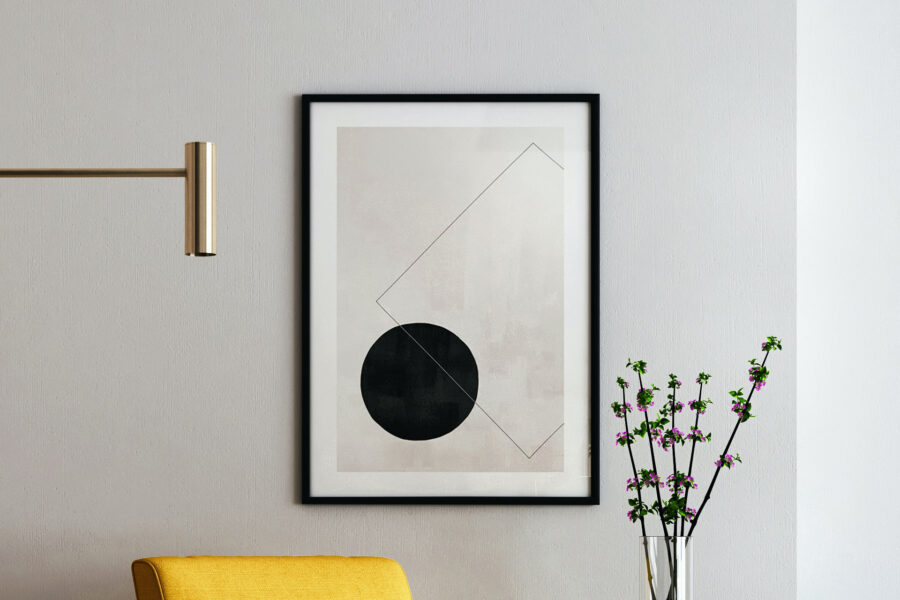 Framed fine art paper print in a black frame with a white mat hanging on a neutral wall
