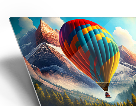 Metal print of a colorful hot air balloon over mountains showing the smooth glossy aluminum surface