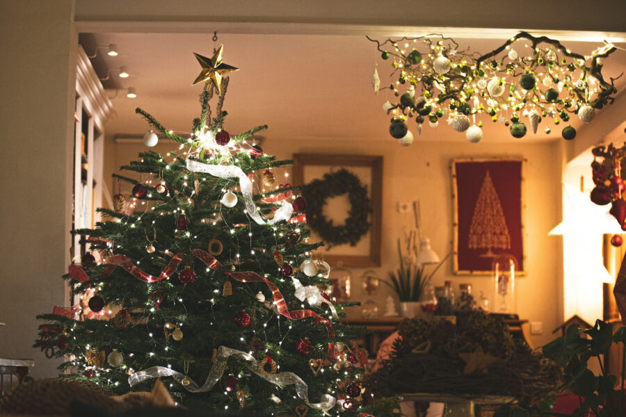 Decorated Christmas tree with lights and ornaments in a festive home interior