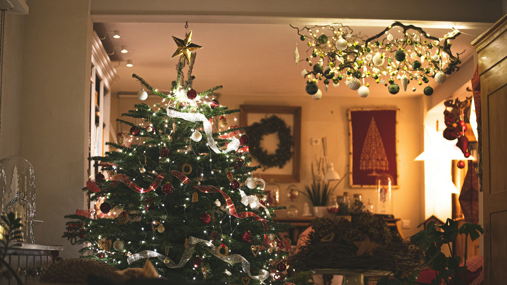 Decorated Christmas tree with lights and ornaments in a festive home interior