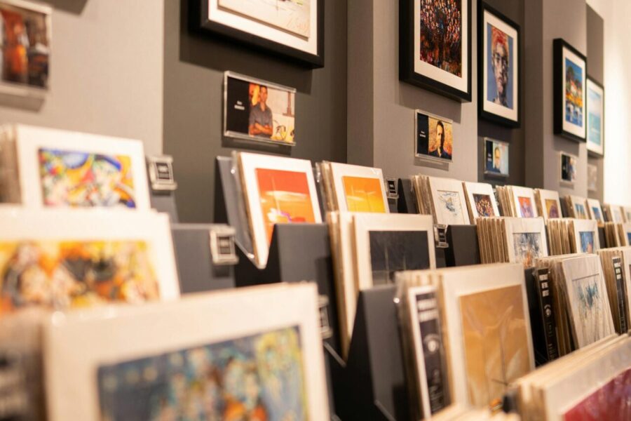 Art gallery display featuring framed wall art and rows of art prints for sale