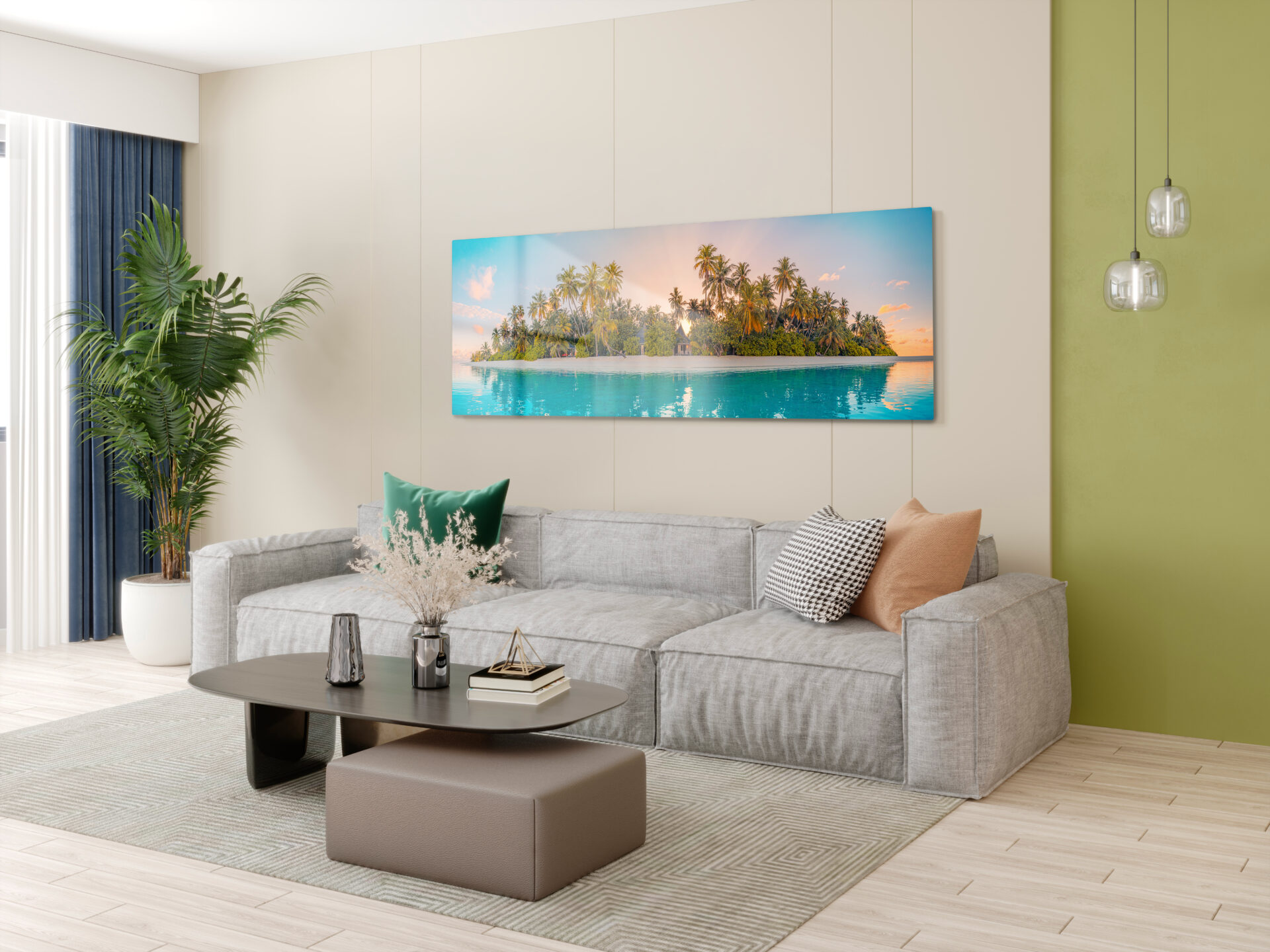 Panoramic metal photo print of a tropical island at sunset hung above a gray sofa in a modern living room