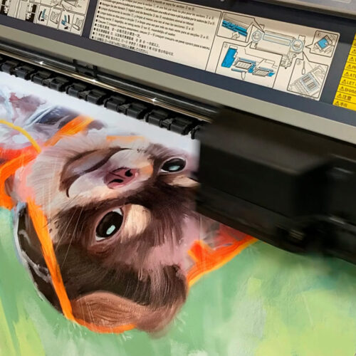 Large-format giclee printer applying archival pigment ink to a painted dog portrait during in-house production