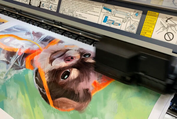 Large-format giclee printer applying archival pigment ink to a painted dog portrait during in-house production